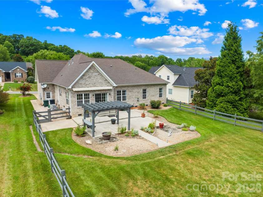 144 Quail Haven Drive, Troutman, NC 28166.  MLS# CAR4401635, YatesRealty ID 41381. Beautiful backyard