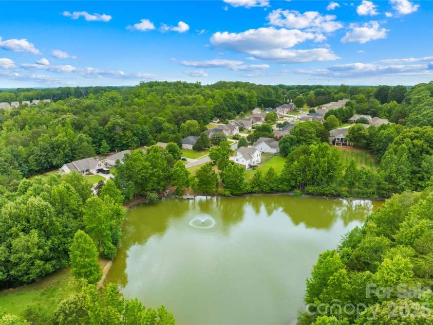 144 Quail Haven Drive, Troutman, NC 28166.  MLS# CAR4401635, YatesRealty ID 41381. Community pond