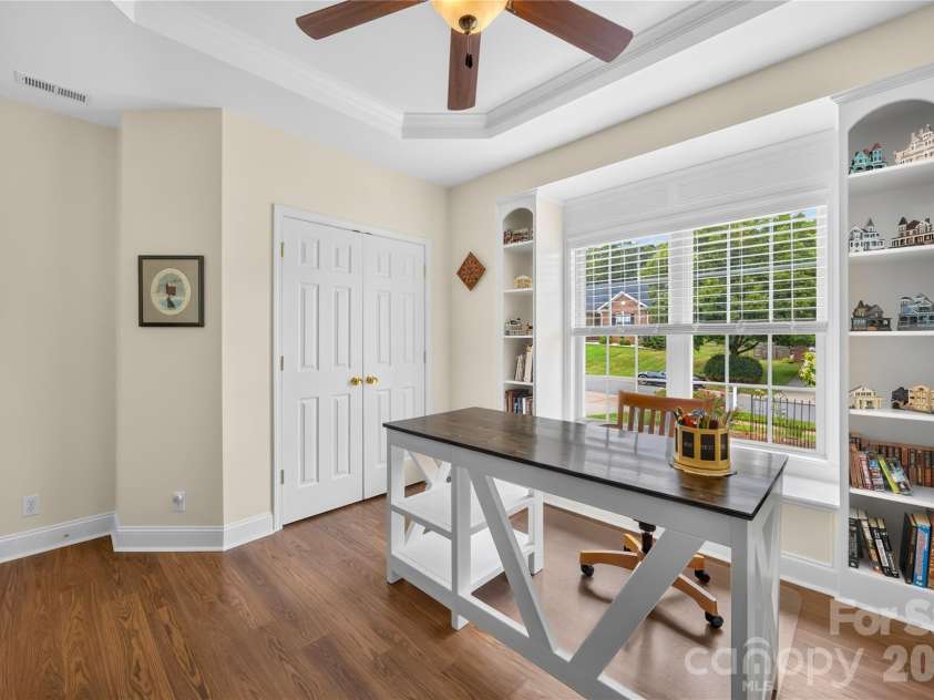 144 Quail Haven Drive, Troutman, NC 28166.  MLS# CAR4401635, YatesRealty ID 41381. Front bedroom used as an office.  Tray ceiling and built-ins.