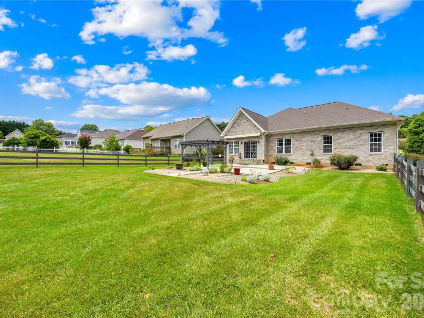 144 Quail Haven Drive, Troutman, NC 28166.  MLS# CAR4401635, YatesRealty ID 41381. Large level fenced yard