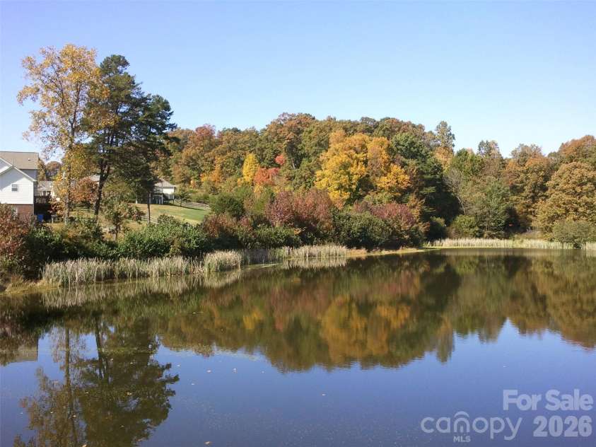 144 Quail Haven Drive, Troutman, NC 28166.  MLS# CAR4401635, YatesRealty ID 41381. Pond in the fall