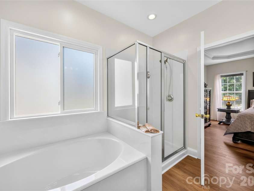 144 Quail Haven Drive, Troutman, NC 28166.  MLS# CAR4401635, YatesRealty ID 41381. Soaking tub and separate shower