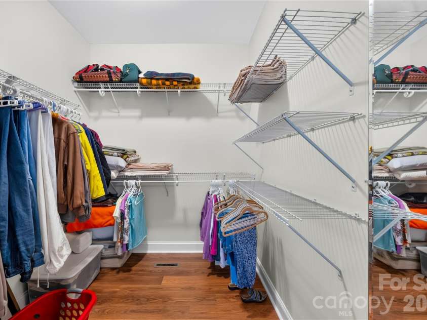 144 Quail Haven Drive, Troutman, NC 28166.  MLS# CAR4401635, YatesRealty ID 41381. Walk-in closet with automatic light