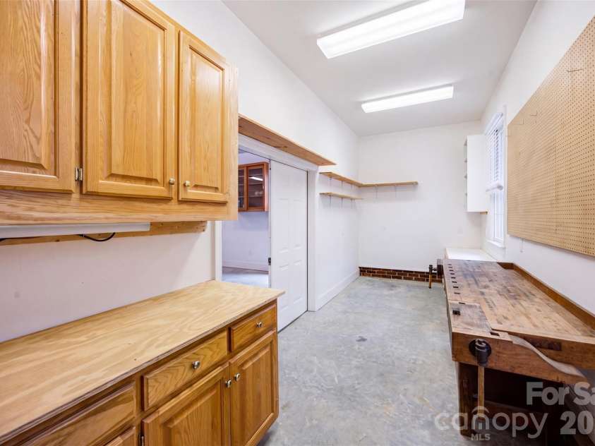 241 Tawny Bark Drive, Mooresville, NC 28117.  MLS# CAR4407043, YatesRealty ID 41390. Workshop just outside within the garage area