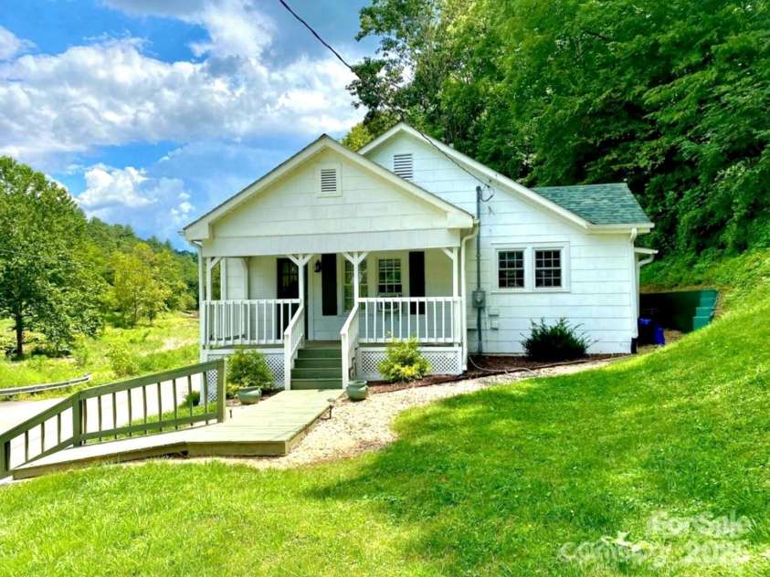 1294 Cane Creek Road, Bakersville, NC 28705.  MLS# CAR4291675, YatesRealty ID 414. Enjoy the babbling brook from this lovely front porch. 