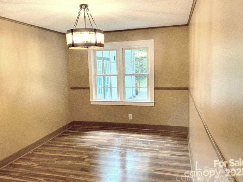 1294 Cane Creek Road, Bakersville, NC 28705.  MLS# CAR4291675, YatesRealty ID 414. Formal or informal this dining room has it all!!