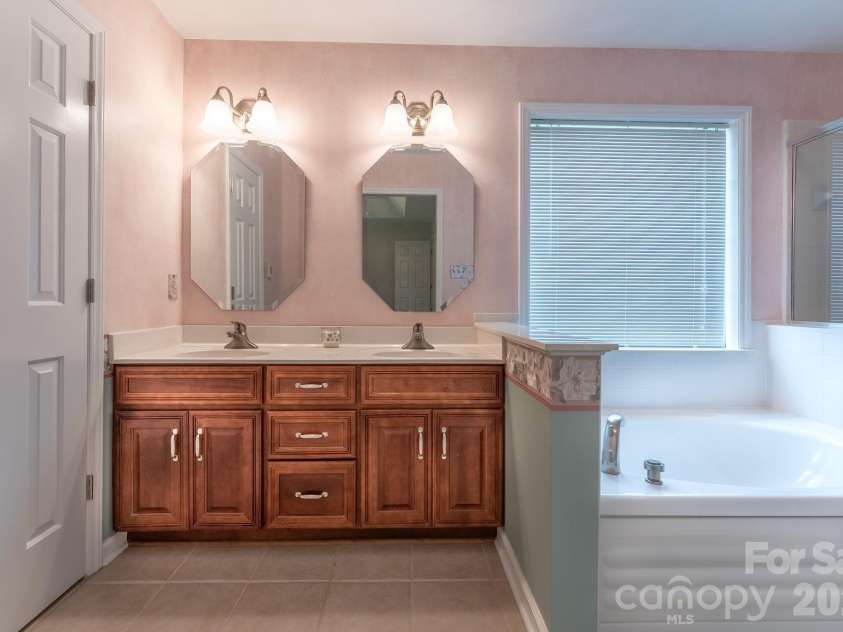 5203 Spring Morning Lane, Monroe, NC 28110.  MLS# CAR4405485, YatesRealty ID 41404. Primary Bathroom