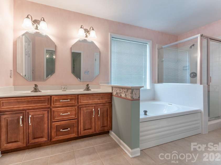 5203 Spring Morning Lane, Monroe, NC 28110.  MLS# CAR4405485, YatesRealty ID 41404. Primary Bathroom