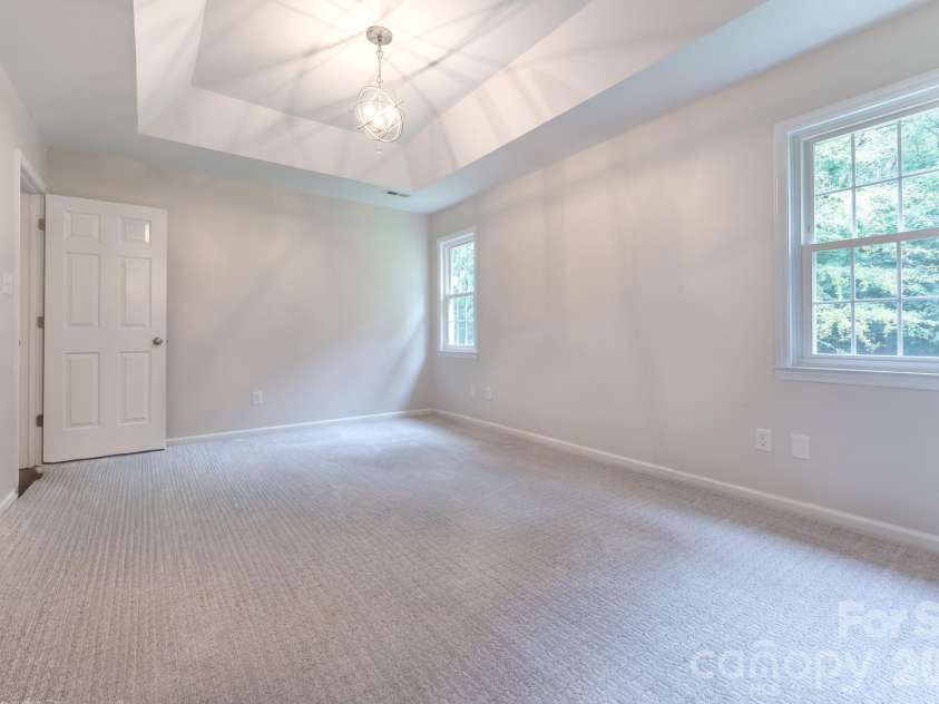 5203 Spring Morning Lane, Monroe, NC 28110.  MLS# CAR4405485, YatesRealty ID 41404. Primary bedroom