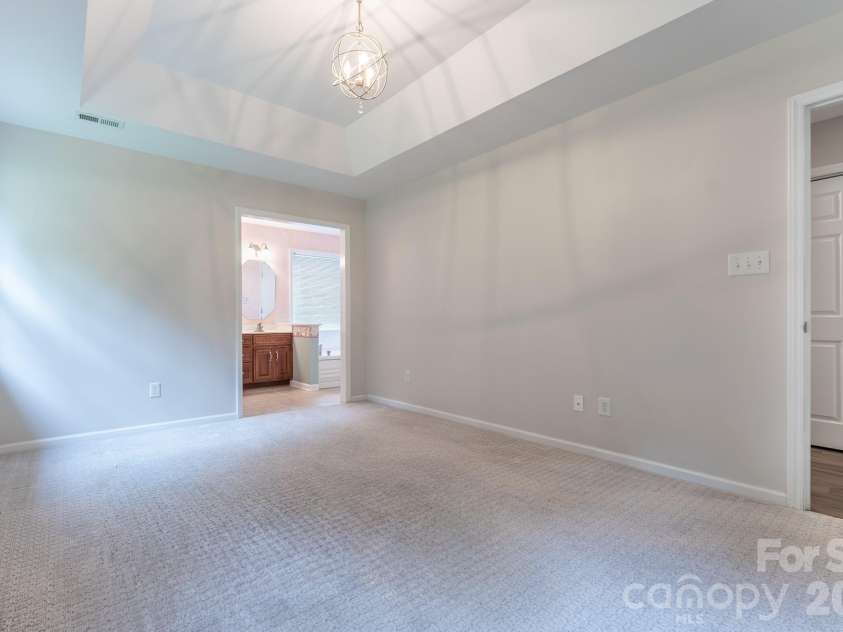 5203 Spring Morning Lane, Monroe, NC 28110.  MLS# CAR4405485, YatesRealty ID 41404. Primary bedroom