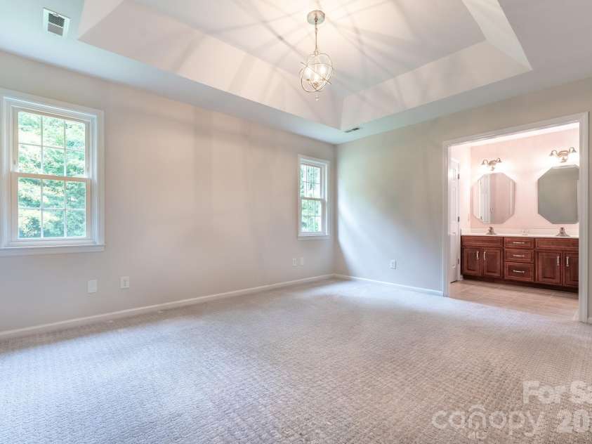5203 Spring Morning Lane, Monroe, NC 28110.  MLS# CAR4405485, YatesRealty ID 41404. Primary bedroom
