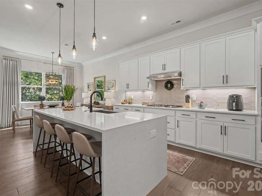 4128 Merkland Lane, Charlotte, NC 28226.  MLS# CAR4409085, YatesRealty ID 41414. Quartz waterfall island