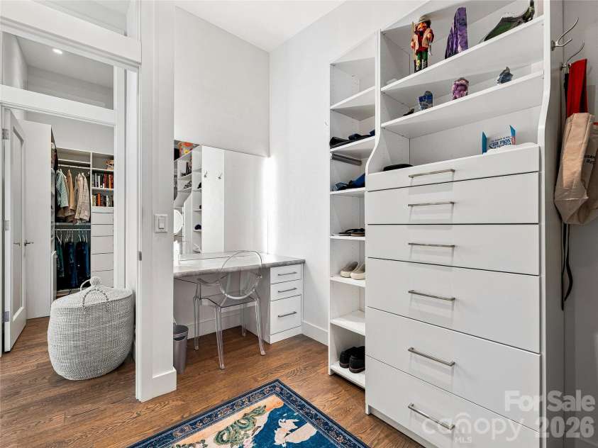 25 Bartrams Walk Drive, Asheville, NC 28804.  MLS# CAR4402146, YatesRealty ID 41418. A dressing area in the second primary closet