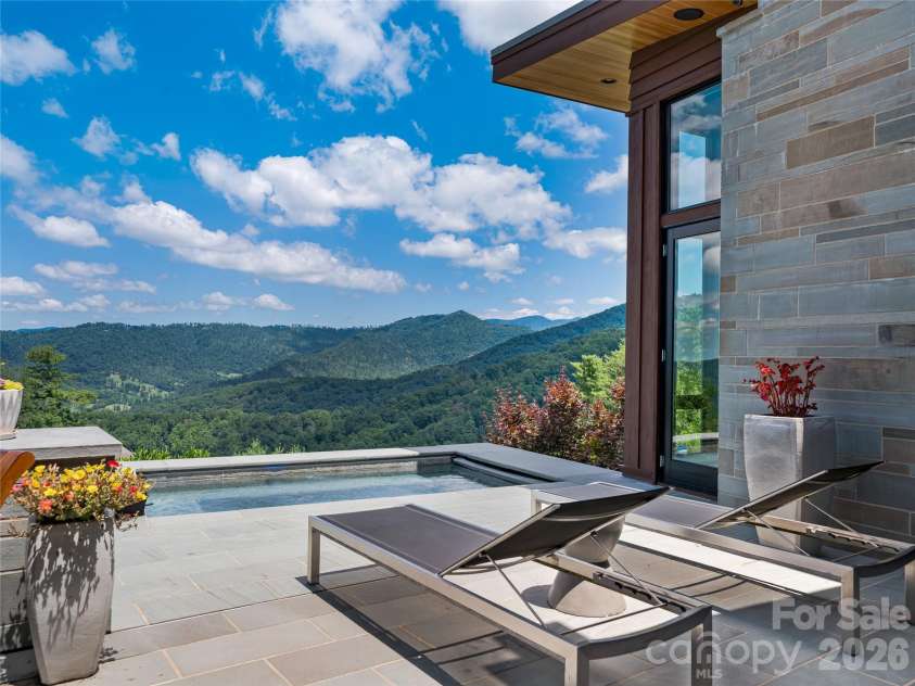 25 Bartrams Walk Drive, Asheville, NC 28804.  MLS# CAR4402146, YatesRealty ID 41418. Built-in spa overlooks Beaverdam Valley