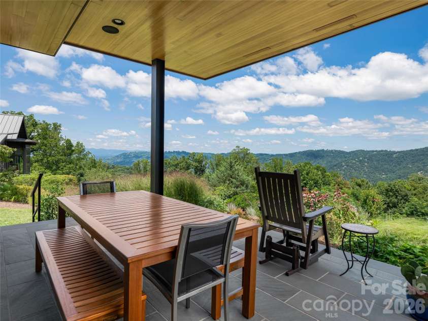 25 Bartrams Walk Drive, Asheville, NC 28804.  MLS# CAR4402146, YatesRealty ID 41418. Covered patio off the dining room offers alfresco dining.