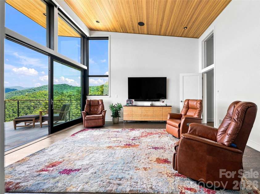 25 Bartrams Walk Drive, Asheville, NC 28804.  MLS# CAR4402146, YatesRealty ID 41418. Floor to ceiling windows have automatic blinds