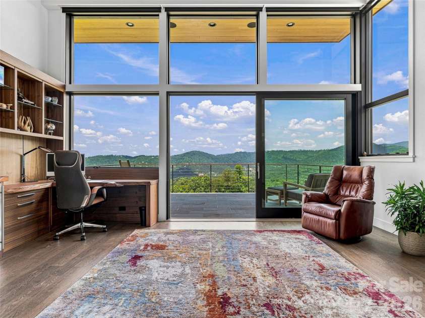 25 Bartrams Walk Drive, Asheville, NC 28804.  MLS# CAR4402146, YatesRealty ID 41418. Work from home in style in this office with an en-suite bathroom and balcony overlooking the mountains.