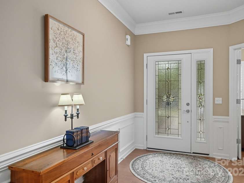 4042 Ambleside Drive, Indian Land, SC 29707.  MLS# CAR4308969, YatesRealty ID 41420. Foyer w/ wainscotting and crown moulding