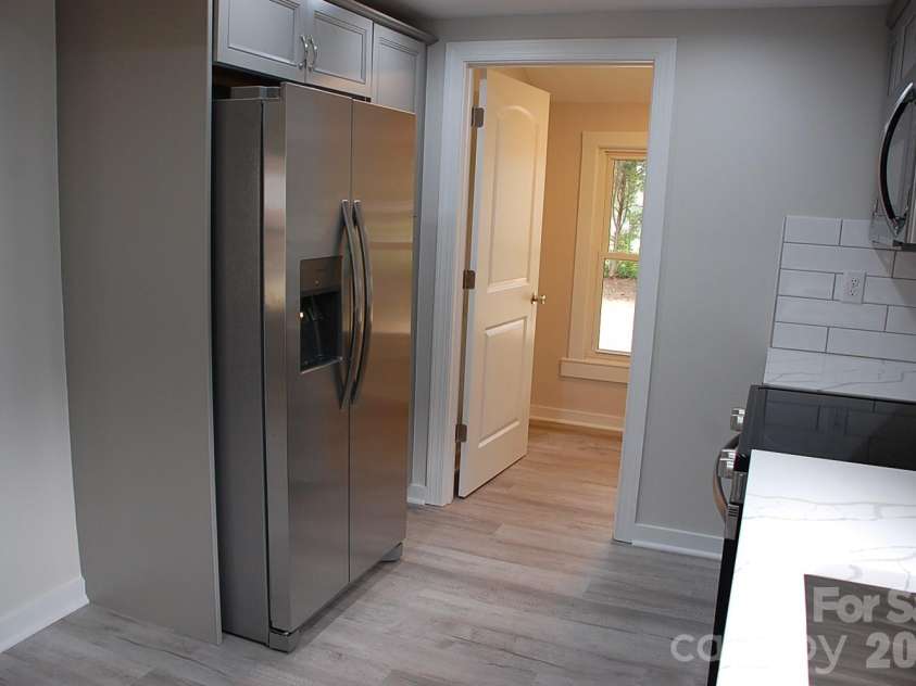 24674 Saint Martin Road, Albemarle, NC 28001.  MLS# CAR4411700, YatesRealty ID 41485. View into laundry room