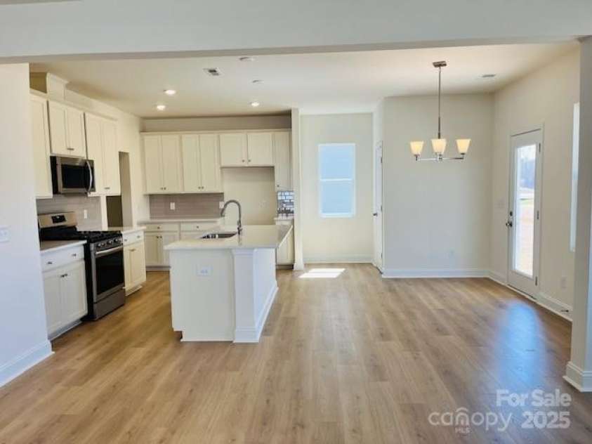 5041 Puddle Pond Road, Indian Trail, NC 28079.  MLS# CAR4302754, YatesRealty ID 415. Photo is for representational purposes only Open layout with the kitchen, dining and great room connected