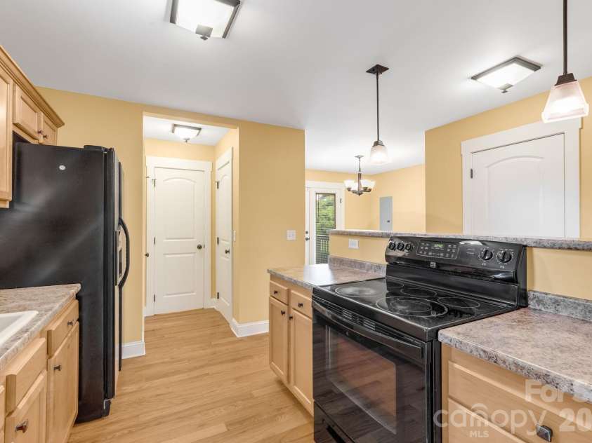 2 Cottage Cove Lane, Asheville, NC 28803.  MLS# CAR4405523, YatesRealty ID 41512. Kitchen Flows to Dining