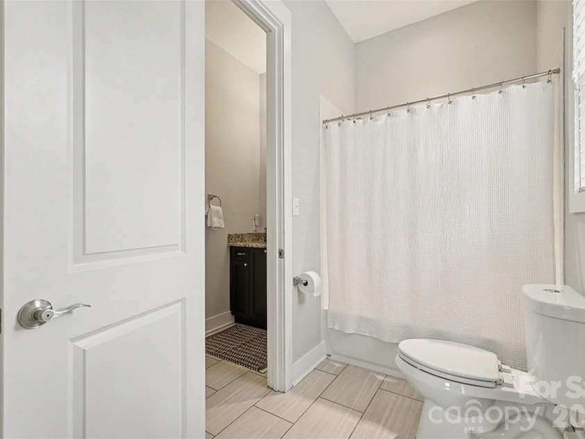 2914 Windsor Avenue, Charlotte, NC 28209.  MLS# CAR4409213, YatesRealty ID 41528. Main level bath connected to bedroom