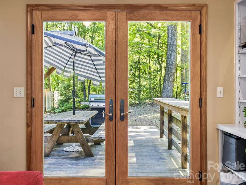 70 Promised Ridge Drive, Hendersonville, NC 28791.  MLS# CAR4411866, YatesRealty ID 41538. Access to back deck from the den