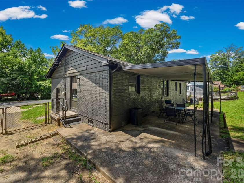 4448 Ridge Valley Drive, Charlotte, NC 28208.  MLS# CAR4410997, YatesRealty ID 41541. Back exterior