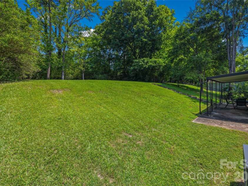 4448 Ridge Valley Drive, Charlotte, NC 28208.  MLS# CAR4410997, YatesRealty ID 41541. Backyard