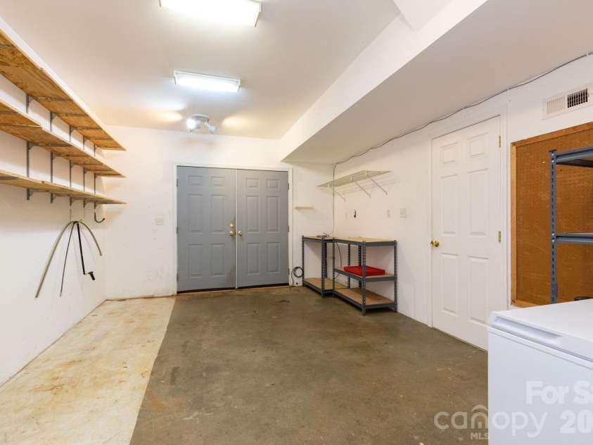 73 Ridge Brook Drive, Weaverville, NC 28787.  MLS# CAR4406346, YatesRealty ID 41544. Heated workshop space