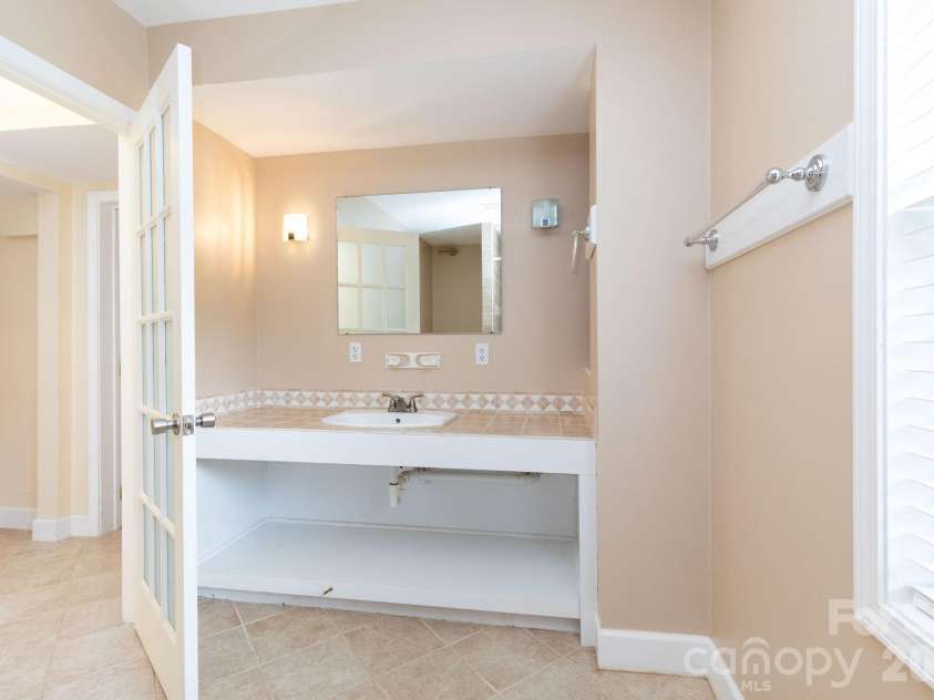 73 Ridge Brook Drive, Weaverville, NC 28787.  MLS# CAR4406346, YatesRealty ID 41544. Lower level bath