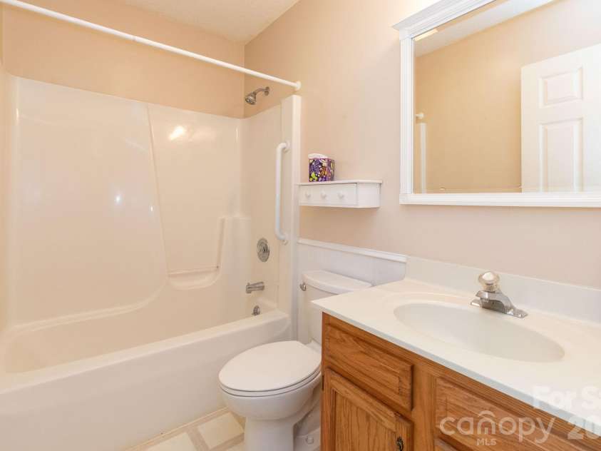 73 Ridge Brook Drive, Weaverville, NC 28787.  MLS# CAR4406346, YatesRealty ID 41544. Main level guest bath