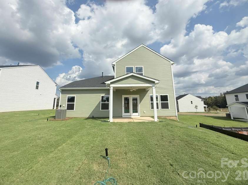 4013 Juno Drive, Charlotte, NC 28215.  MLS# CAR4407718, YatesRealty ID 41547. Spacious Backyard w/ Covered Porch