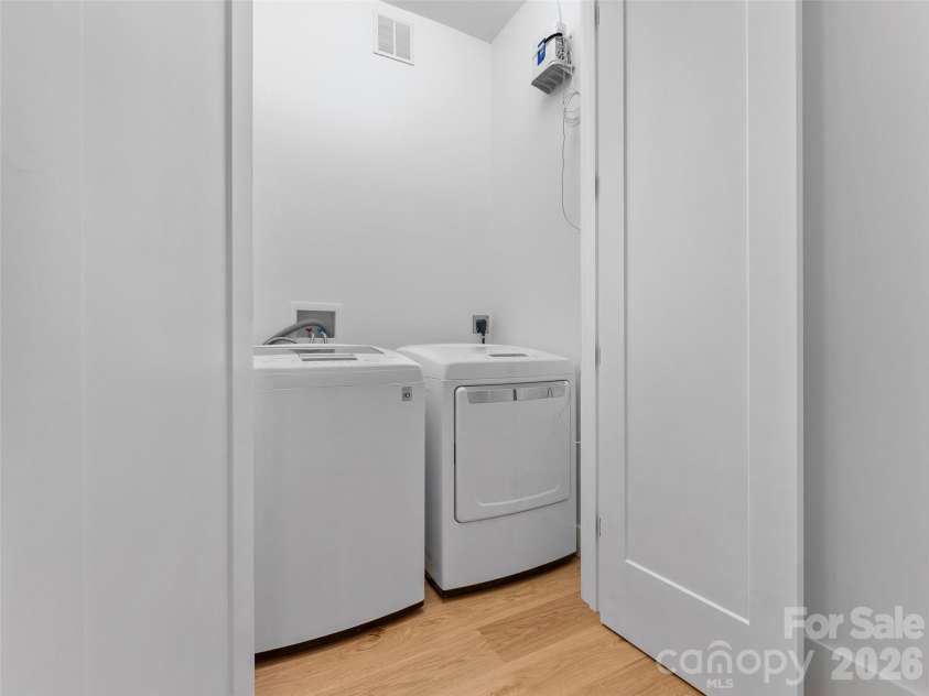 80 Maple Grove Court, Hendersonville, NC 28792.  MLS# CAR4409881, YatesRealty ID 41559. Secondary Laundry on Lower Level