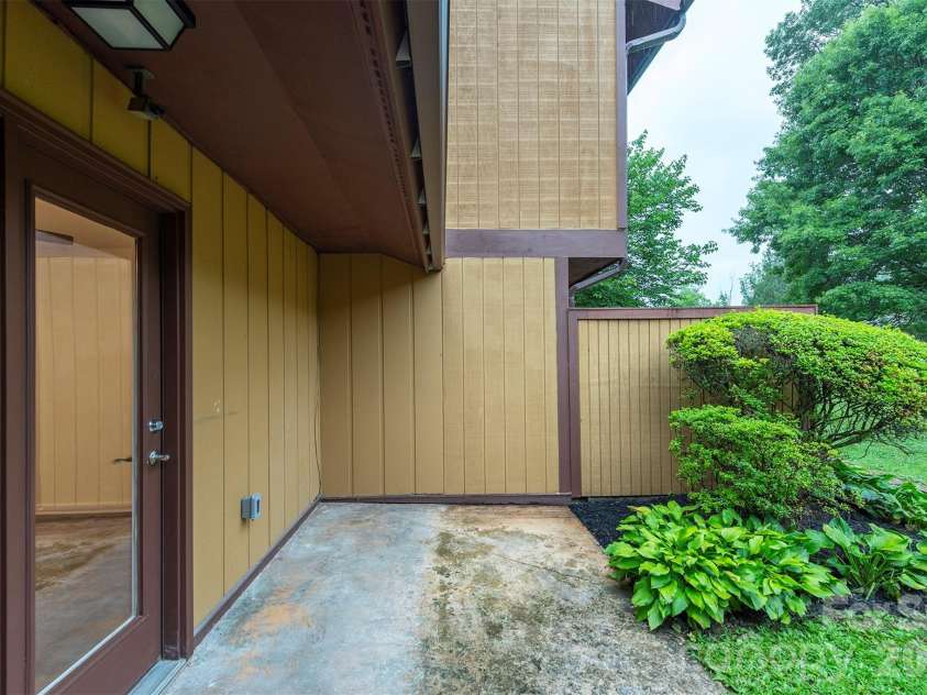 129 Colony Drive, Arden, NC 28704.  MLS# CAR4407138, YatesRealty ID 41561. Back Patio