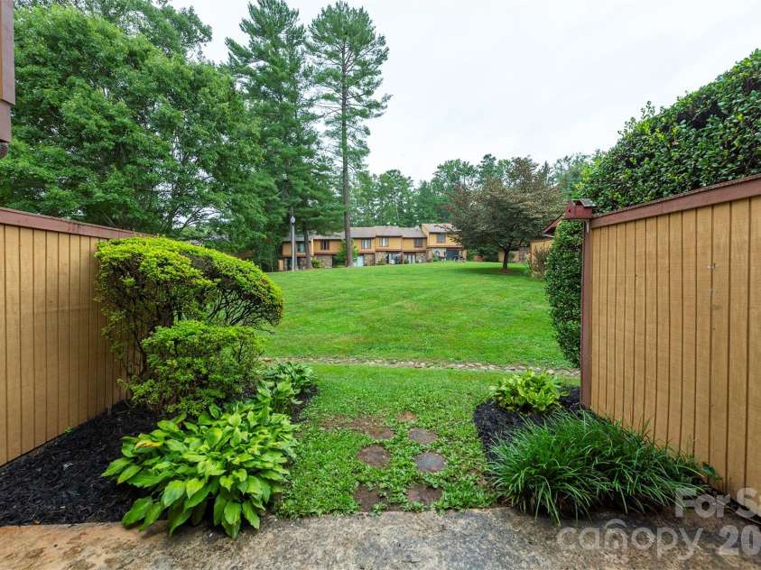 129 Colony Drive, Arden, NC 28704.  MLS# CAR4407138, YatesRealty ID 41561. Back patio