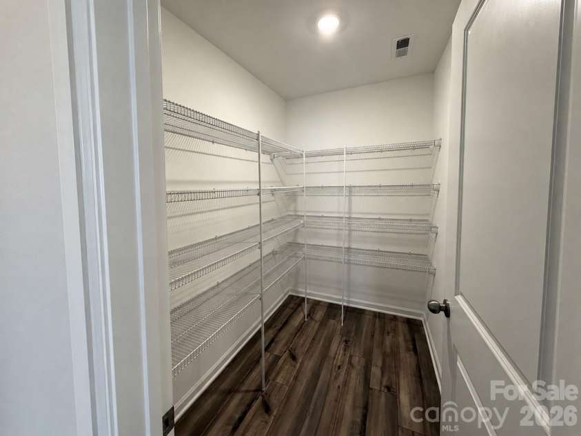 161 Spotted Way, Troutman, NC 28166.  MLS# CAR4406028, YatesRealty ID 41562. Generous Kitchen Pantry