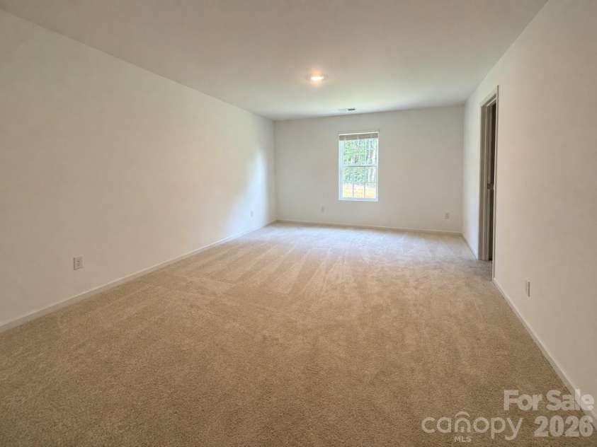 161 Spotted Way, Troutman, NC 28166.  MLS# CAR4406028, YatesRealty ID 41562. Owners bedroom w ensuite bath