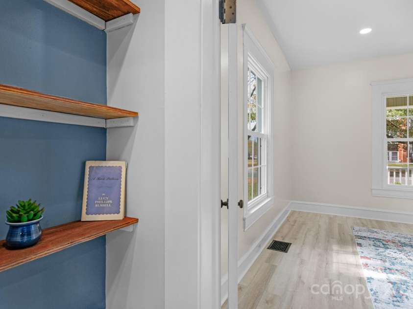 107 Rockingham Road, Rockingham, NC 28379.  MLS# CAR4332432, YatesRealty ID 4157. Shelves on both sides and could be used as a Pantry or Bookshelves