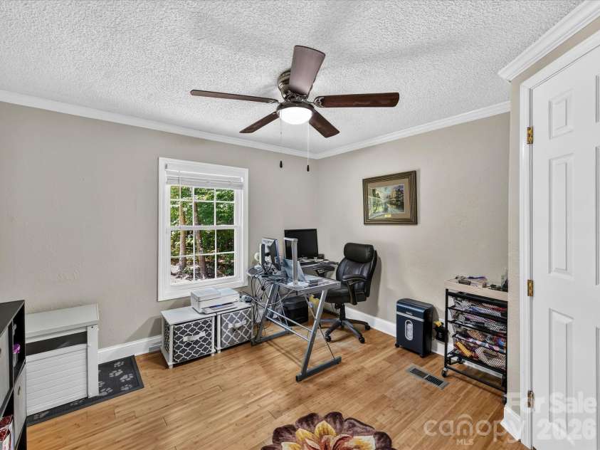 4486 Graybirch Drive, Maiden, NC 28650.  MLS# CAR4409913, YatesRealty ID 41573. Spacious Bedroom 2 features crown molding, ceiling fan/light & walk in closet.