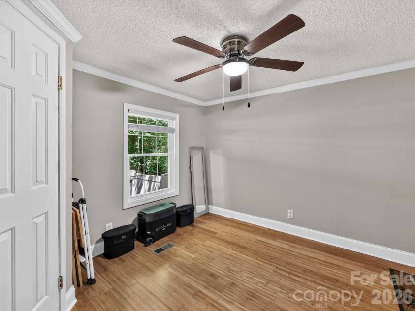 4486 Graybirch Drive, Maiden, NC 28650.  MLS# CAR4409913, YatesRealty ID 41573. Spacious Bedroom 3 features crown molding, ceiling fan/light & walk in closet.