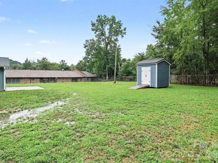 1352 Steed Street, Rock Hill, SC 29732.  MLS# CAR4411220, YatesRealty ID 41581. Backyard and storage shed