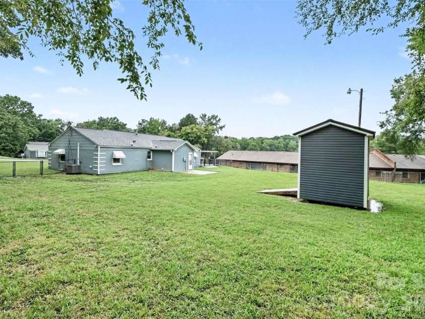 1352 Steed Street, Rock Hill, SC 29732.  MLS# CAR4411220, YatesRealty ID 41581. Backyard with storage shed