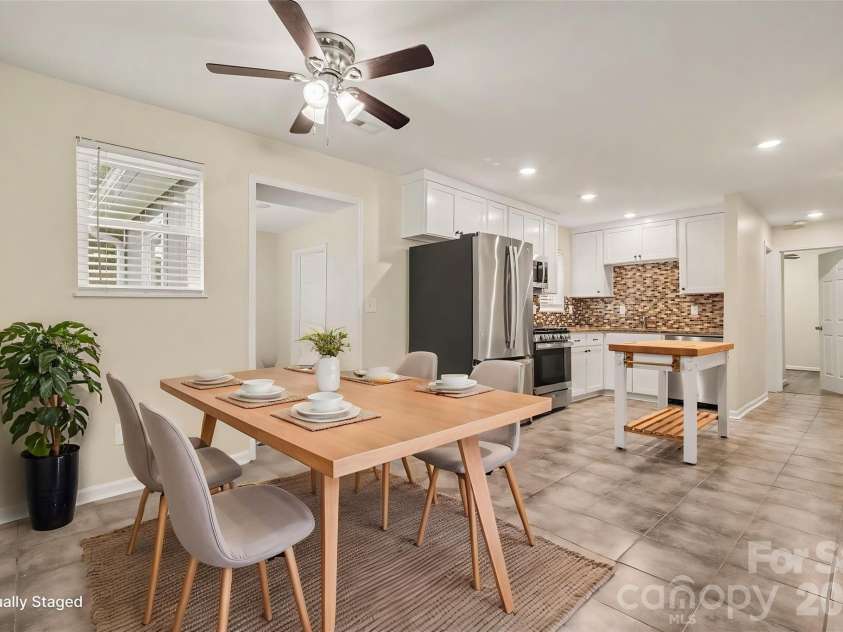 1352 Steed Street, Rock Hill, SC 29732.  MLS# CAR4411220, YatesRealty ID 41581. Dining area into kitchen *virtually staged*