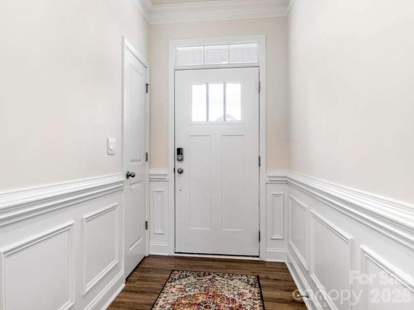 4197 Millstream Road, Denver, NC 28037.  MLS# CAR4408202, YatesRealty ID 41586. Step into elegance with bright, neutral tones and classic wainscoting. Wide hallways throughout the home maximize accessibility and create seamless flow between spaces.