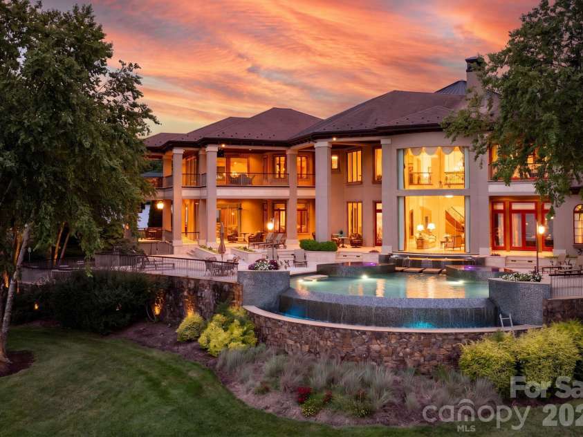 139 Hollen Lane, Mooresville, NC 28117.  MLS# CAR4406781, YatesRealty ID 41591. Resort Like Lakeside Setting with Stunning Infinity Pool