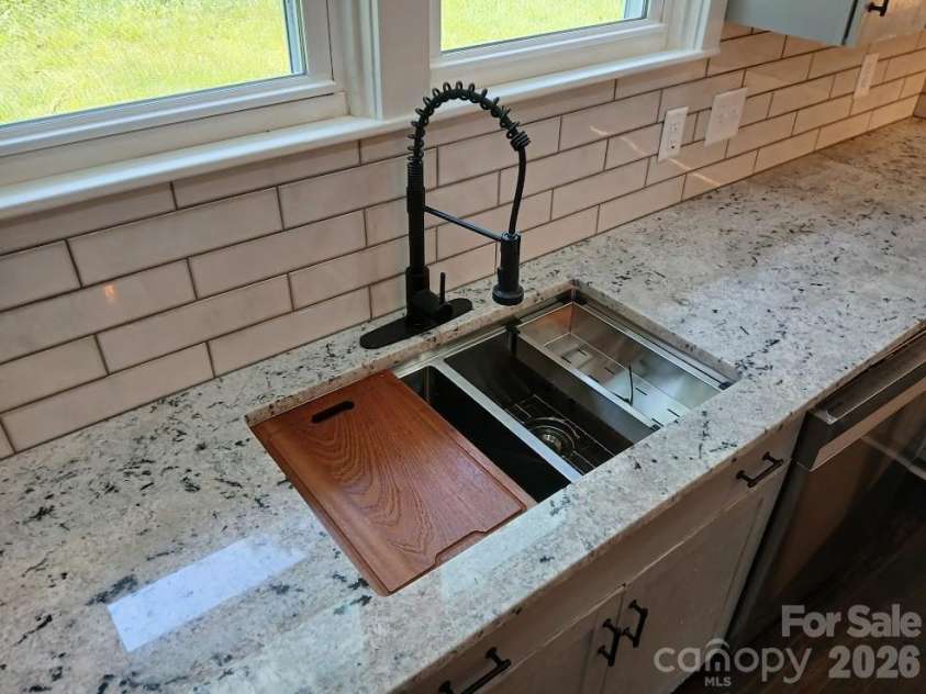 105 Inman Avenue, Bessemer City, NC 28016.  MLS# CAR4337137, YatesRealty ID 4163. Stainless Steel Workstation sink with Basin Rack, Colander and Wooden Cutting Board