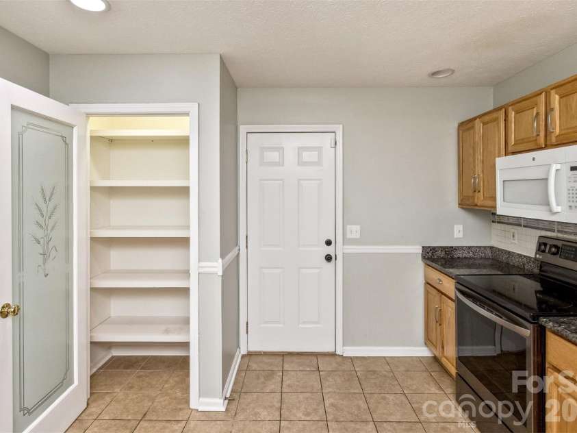 100 Titleist Way, Hendersonville, NC 28739.  MLS# CAR4407640, YatesRealty ID 41644. Pantry & Garage Access