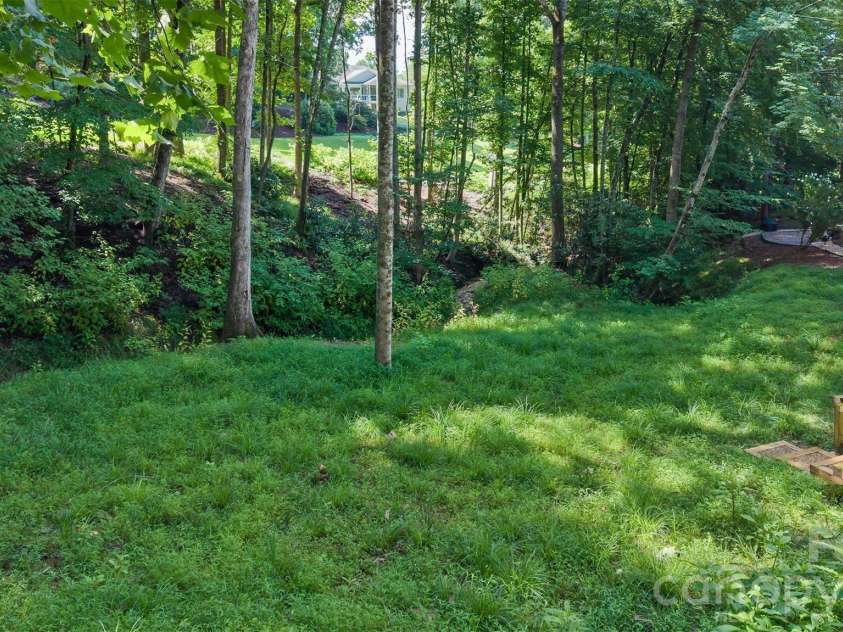 100 Titleist Way, Hendersonville, NC 28739.  MLS# CAR4407640, YatesRealty ID 41644. Stream side space