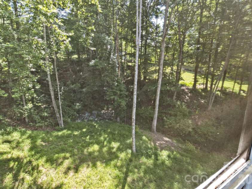 100 Titleist Way, Hendersonville, NC 28739.  MLS# CAR4407640, YatesRealty ID 41644. Upper Deck Stream View
